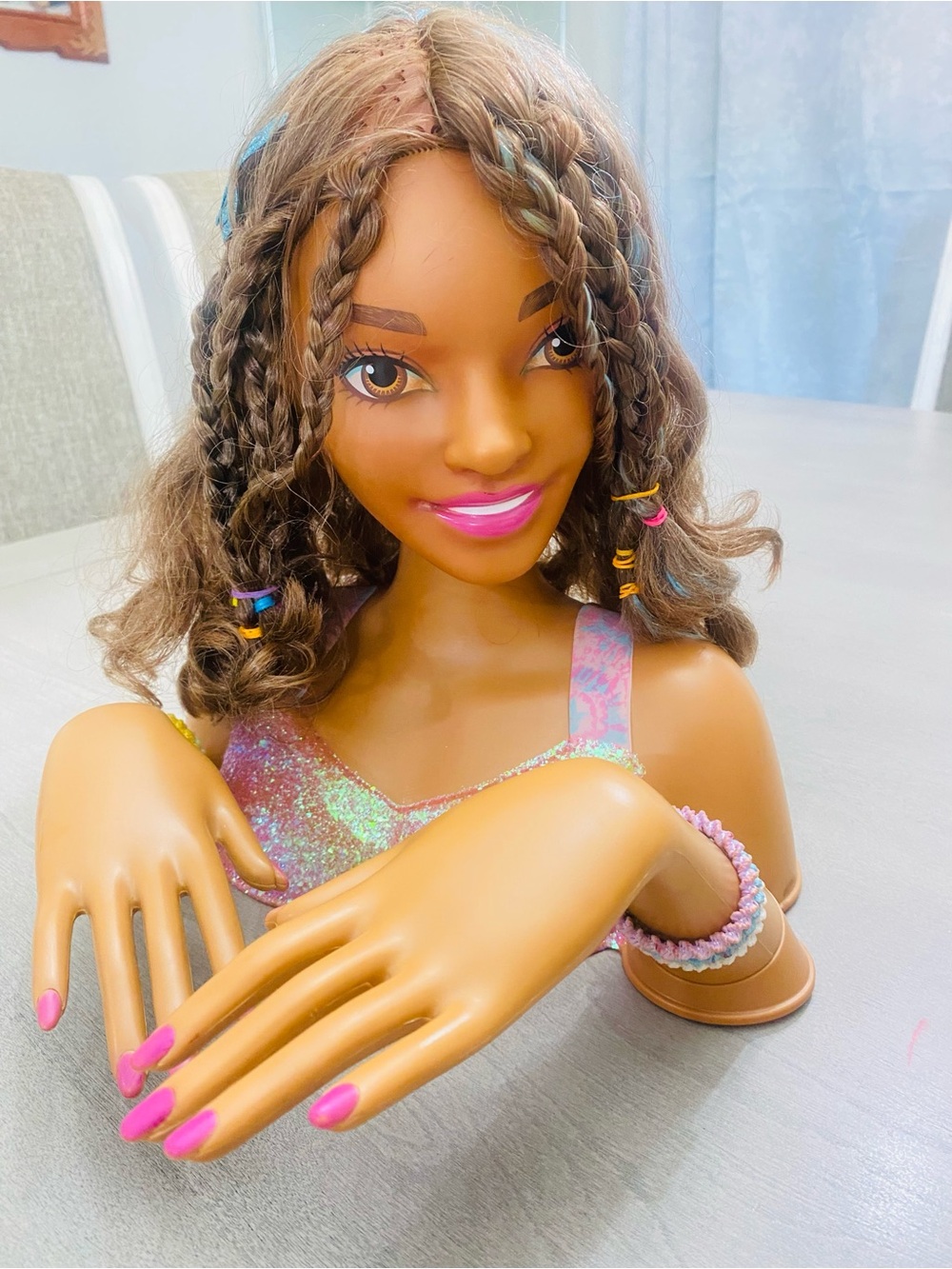 Styling Head Doll with Braided Hair and Pink Accents